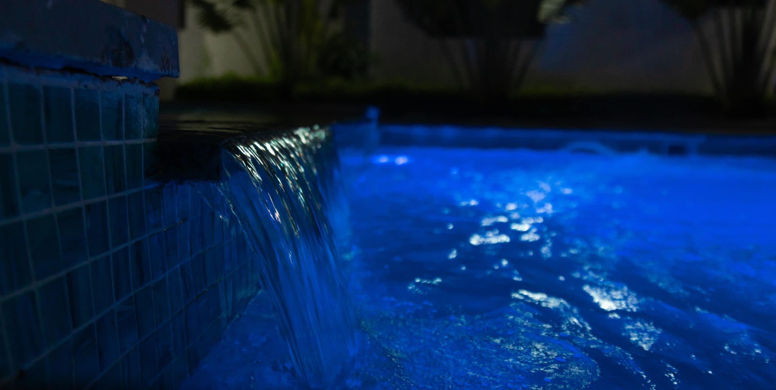 The water feature at the edge of the pool